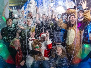 Winter Wonderland The MadeBrave Team stands inside an inflatable snow globe