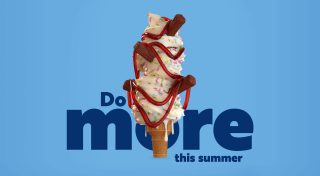 giant soft serve ice cream with flake and raspberry sauce with text that says 