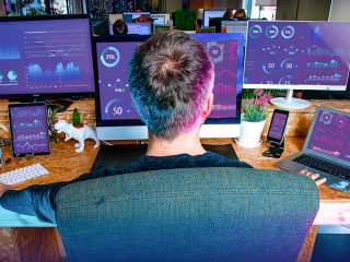 Marketing robot in front of multiple machines