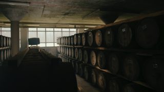 Deanston warehouse showing several whisky barrels