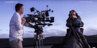Virtual Production & The Mandalorian Man with camera on set shooting Kuiil from the Mandalorian