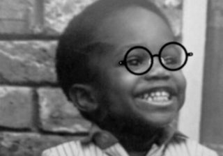 Photo of little boy with glasses drawn on