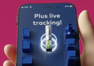 Animation Still showing hand holding a phone. Screen on the phone shows a bus with text 