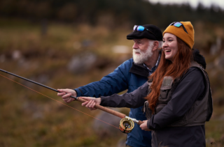 Woman Fishing with Her Grandpa