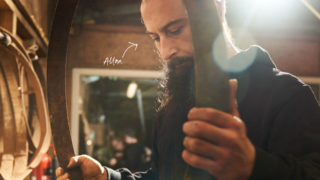 photo of Alan the Barrel Cooper holding a metal hoop