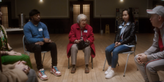 four characters from a film acting silly while standing