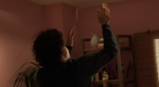 behind the scenes - man adjusting lighting