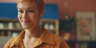 woman with short red hair smiling