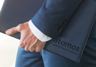 photo of a man holding a black leather atomos Branded Leather Case