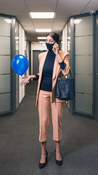 Blue Balloon Campaign - Europe photo of a woman in a business suit keeping a blue balloon up in the air