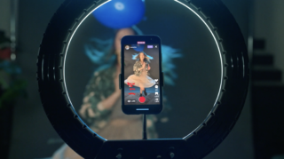 photo of someone capturing video of them doing the blue balloon challenge