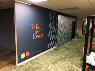 photo of Bella & Duke's New Office with a wall Vinyl which says 