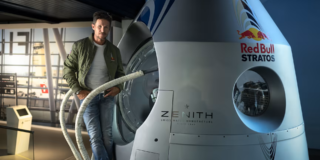 Red Bull x GoPro photo of Felix Baumgartner standing in front of red bull stratos module