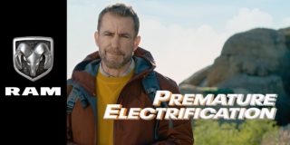 A super bowl commercial still of a rugged man with a beard in a waterproof jacket wearing a backpack and looking into the camera and 
