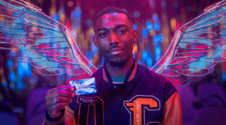 Main Character from film cast in pink and blue light with wings, holding up their NEC card.