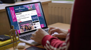 Teenager looking at The Skinny website which has been reskinned in the U22 campaign branding.