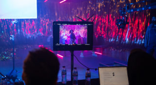 Director and Creative Lead watching footage on the monitor.