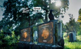 GraveInfluence photo of two graves with a screen on it displaying a headshot of Andrew Dobbie and Ash Jones