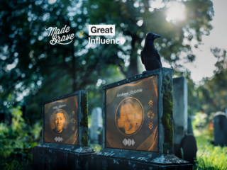 photo of two graves with a screen on it displaying a headshot of Andrew Dobbie and Ash Jones