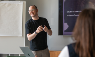 Mark Cullen, Head of Strategy | MadeBrave a photo of mark cullen giving a presentation