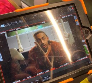 behind the scenes photo of a Jordan Stephens shooting for the 'my bus' film