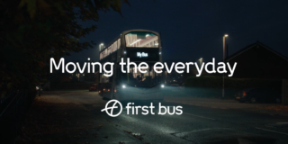 photo of a bus at night time with 'Moving the everyday' and the first bus logo in white over the top