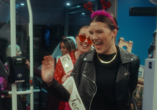 photo of a few women on a hen do getting on a bus