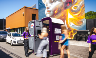 a photo of people going into the portal-loo