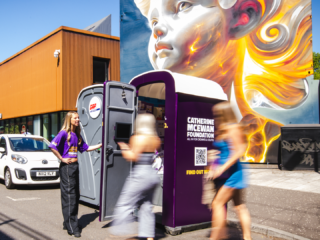 a photo of people going into the portal-loo