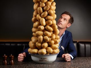 Andy Murray Gets Brand Distinctiveness - Do You? a photo of andy murray looking up at a towering stack of potatoes