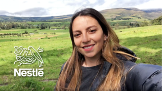 a photo of a young woman taking a selfie in a field and a white nestle logo over the top