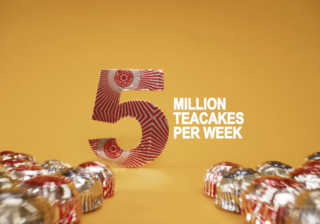 Tunnock's Brand Film - Five Million Teacakes a photo of a foil-wrapped red 5 with 'million teacakes per week' in white, all on a yellow background with teacakes in the foreground